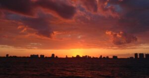 a sunset over a body of water