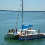 a sail boat in a large body of water