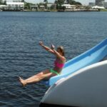 a person in a blue boat on a body of water