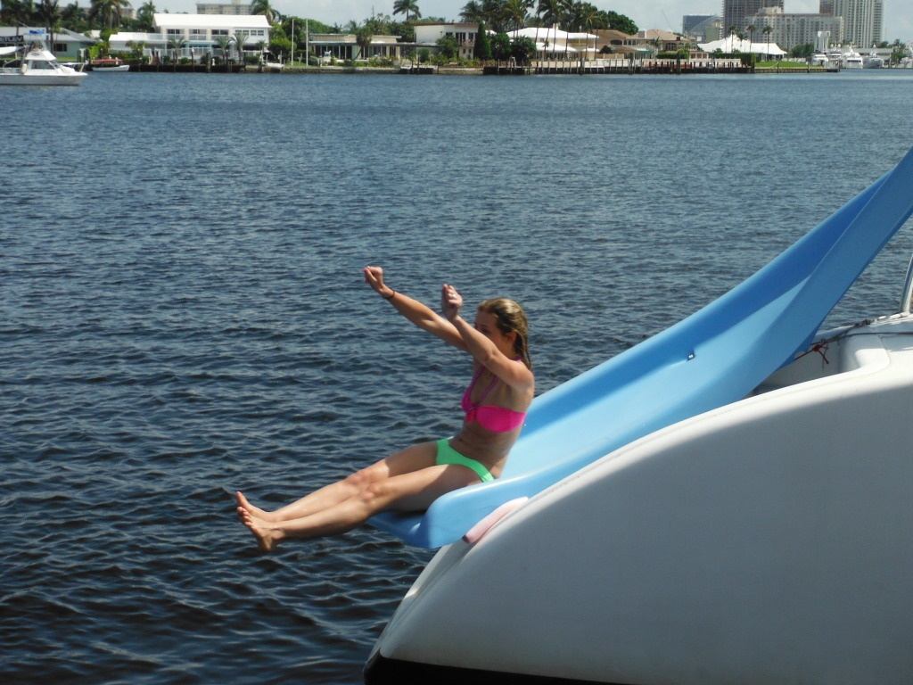 a person in a blue boat on a body of water