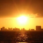 a sunset over a body of water