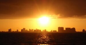 a sunset over a body of water