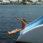 a person in a blue boat on a body of water