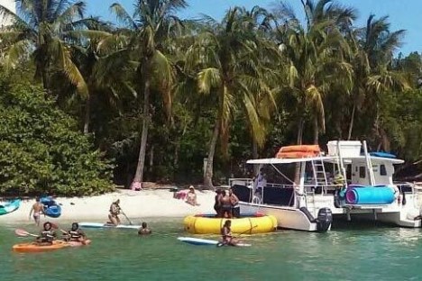 a group of people on a boat in the water